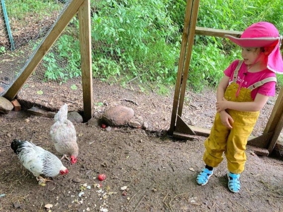 Girl with chickens.