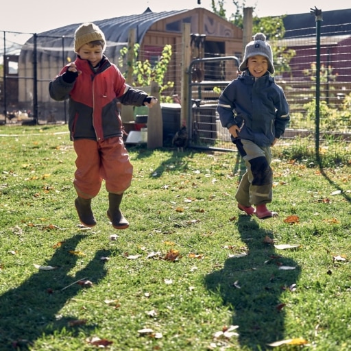 Boys skipping in yard